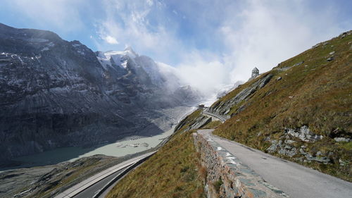 Panoramic view of road amidst mountains against sky
