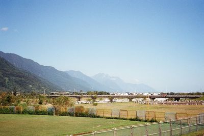 Scenic view of field against clear sky