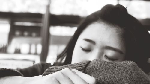 Close-up portrait of woman resting