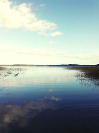 View of lake against cloudy sky