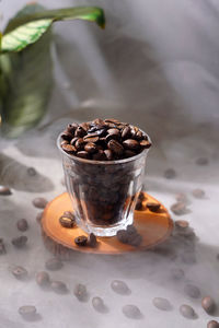 Coffee beans in cup with smoke