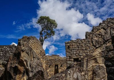 Low angle view of fort against blue sky