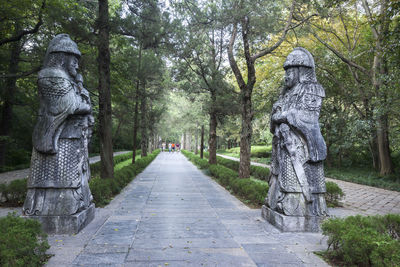 Statue amidst trees