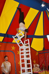 High angle view of people with yellow umbrella