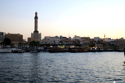 Buildings in city at sunset