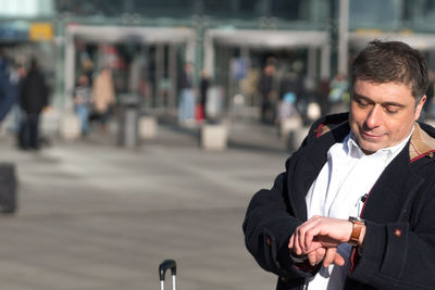 Close-up of man in city