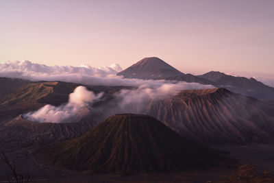 Scenic view of snowcapped mountains against sky during sunset