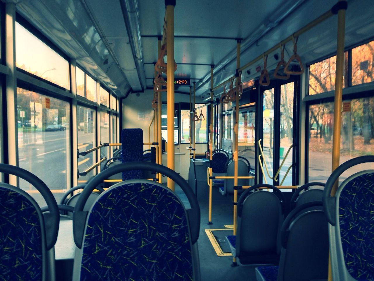 indoors, window, transportation, interior, vehicle interior, architecture, mode of transport, absence, empty, built structure, glass - material, vehicle seat, chair, seat, ceiling, no people, transparent, public transportation, sunlight, travel