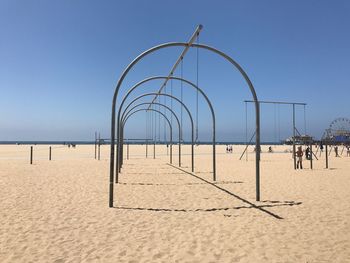 Scenic view of beach against clear sky