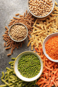 A variety of fusilli pasta made from different types of legumes, green and red lentils, mung 