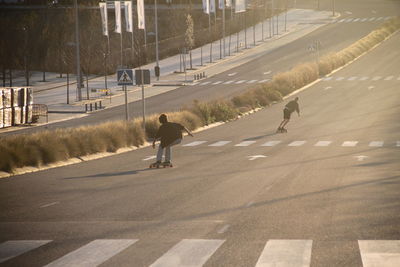 People skating on road