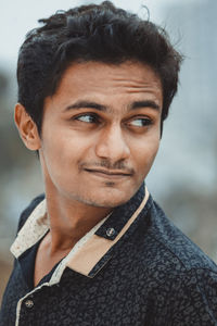 Close-up portrait of smiling mid adult man