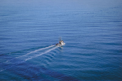 High angle view of sailboat sailing in sea