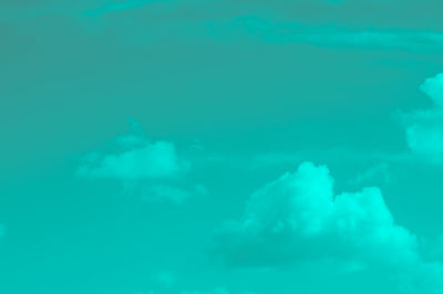 Low angle view of sea against blue sky