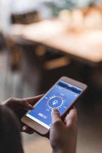 Close-up of hand holding mobile phone