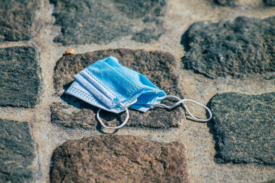 High angle view of shoes on rocks