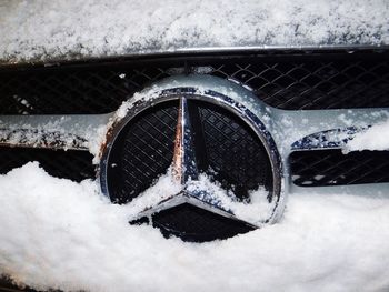 High angle view of snow covered metal