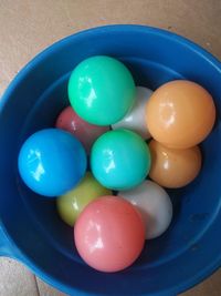 Close-up of colorful balls in bucket