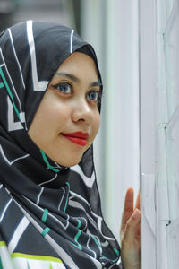 Close-up portrait of a smiling young woman