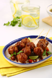 Meatballs served in plate on table