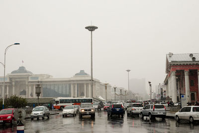 Cars on street in rain