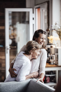 Rear view of women sitting at home