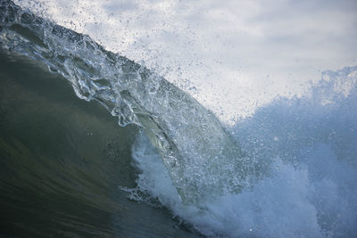 Sea waves splashing on shore