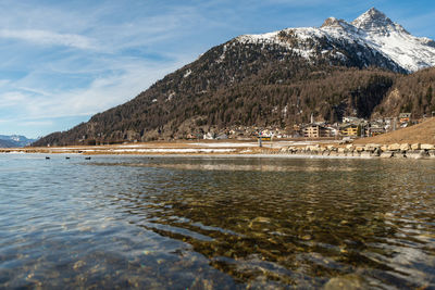 Silvaplana, switzerland, february 21, 2023 winter landscape scenery with a frozen lake of silvaplana