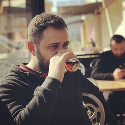 Man having drink at cafe