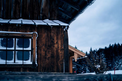 Low angle view of house against sky during winter