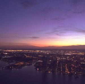 Aerial view of city at sunset