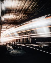 Blurred motion of train at railroad station at night