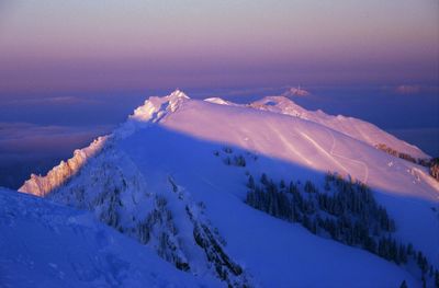 Scenic view of snow covered landscape against sky