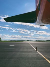 Scenic view of airport runway against sky