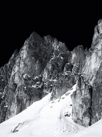 Low angle view of ski lift against mountain