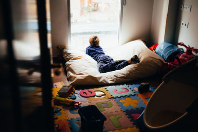 Girl lying on bed at home