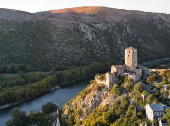 High angle view of castle on riverbank