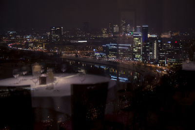 High angle view of illuminated buildings in city at night