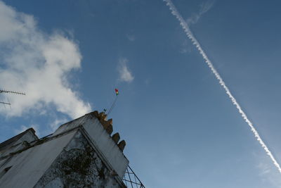 Low angle view of built structure against blue sky