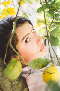 Portrait of young woman looking away