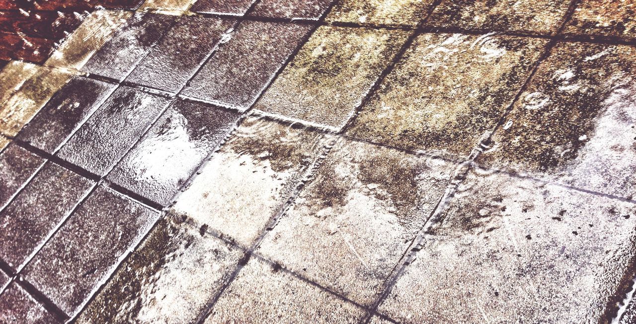 high angle view, paving stone, pattern, tiled floor, cobblestone, full frame, street, footpath, flooring, shadow, backgrounds, wet, sidewalk, tile, sunlight, reflection, puddle, textured, day, pavement