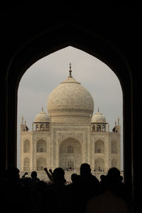 Taj mahal seen through arch