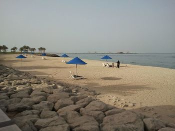 Scenic view of beach against clear sky