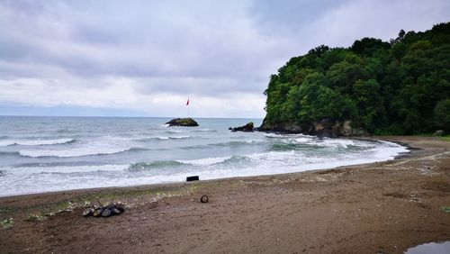 Scenic view of beach against sky