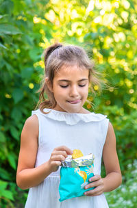 Cute girl eating potato chip