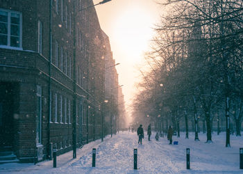 People walking on snow covered street