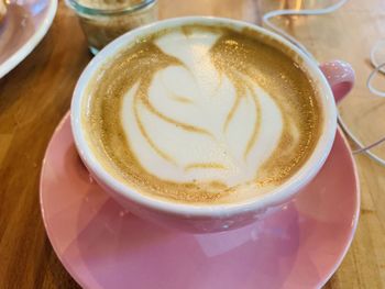 Close-up of cappuccino on table