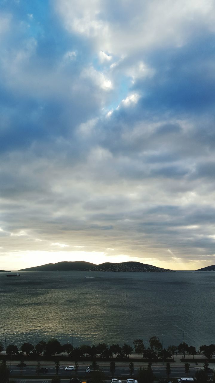 sky, transportation, cloud - sky, mode of transport, water, cloudy, sunset, land vehicle, nautical vessel, nature, cloud, river, scenics, car, sea, beauty in nature, tranquility, tranquil scene, outdoors, weather