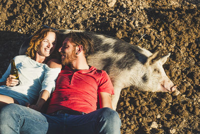 Young couple sitting outdoors