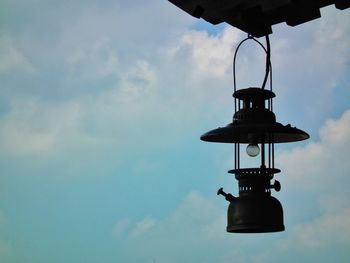 Low angle view of lamp post against sky